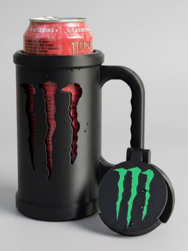 Black mug with Monster Energy logo, can of Monster Energy drink, and bottle cap on a wooden surface.