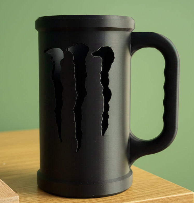 Black mug with a logo on a wooden surface